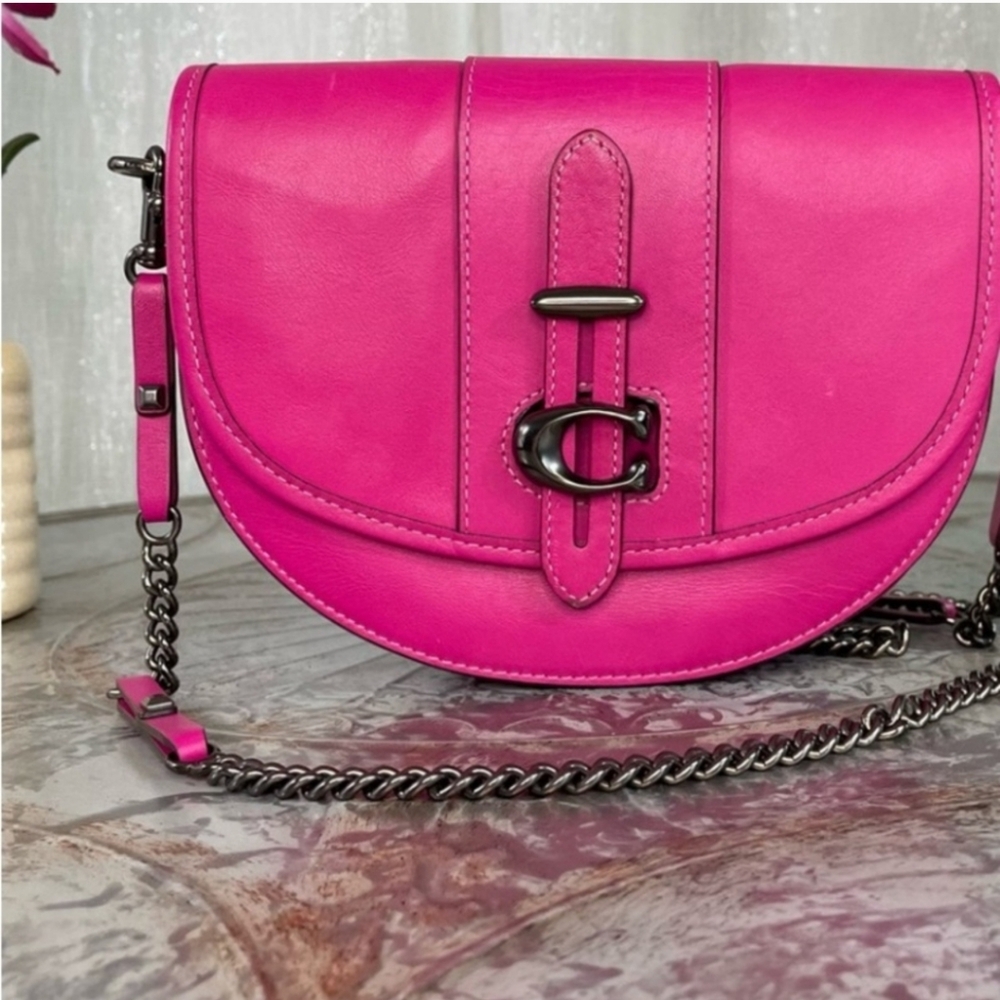 Coach, pink, glove tanned leather, with black gunmetal hardware.